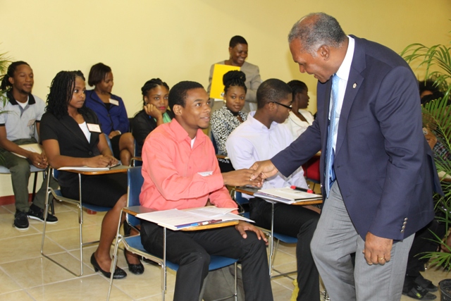 Premier of Nevis and Minister of Education Hon. Vance Amory and Principal Education Officer Palsy Wilkin interact with participants at the Department of Education’s 2016 Prospective Teachers’ Course on June 20, 2016 at the Department’s conference room at Pinney’s Industrial Site
